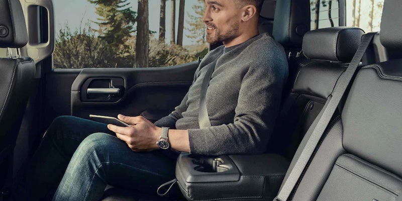 Man sitting in 2022 GMC Sierra HD AT4