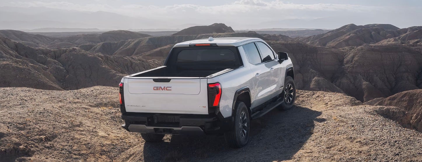 White 2026 GMC Sierra EV overlooking a cliff near Burleson, TX